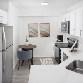 Camden Plantation Apartments in Plantation, FL Kitchen with Quartz Countertops and Stainless Steel Appliances