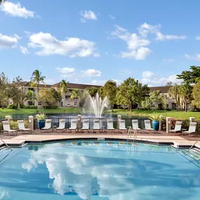 Pool with expansive sundeck alongside lake