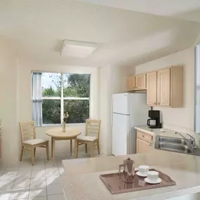 Kitchen with laminate countertops white appliances and breakfast nook