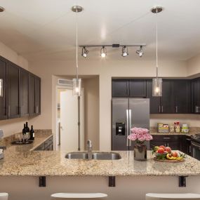 Kitchen with granite countertops gas cooktop and stainless steel appliances
