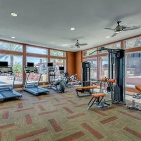 24 hour fitness center with cardio and strength training equipment