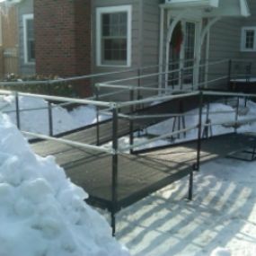 Amramp’s steel, mesh platforms do not accumulate snow or moisture as this residential ramp installation in Buffalo shows.
