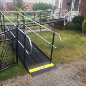 Amramp Long Island provided a smooth landing position at this New Hyde Park, NY home by adding a grass blocker at the bottom of the wheelchair ramp.