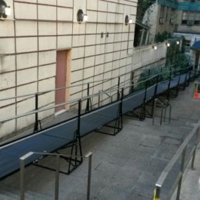 The City of New York closed down the front entrance of this residential apartment building on East 23rd Street in Manhattan for repairs. The building owners turned to Amramp Long Island to install this 84 foot ADA compliant modular wheelchair ramp to provide temporary access for their residents and visitors while the repairs are being completed.