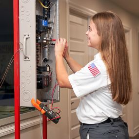 Mrs. Michael Electrician working on panel