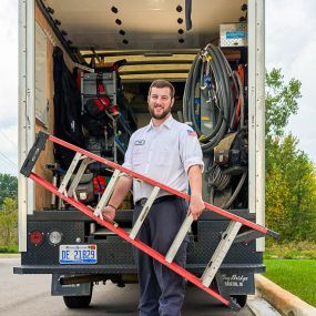 Mrs. Michael Electrician outside of van