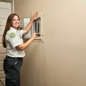 Mrs. Michael Electrician working on panel