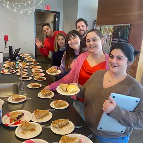 The culture team at Two Rivers Marketing sharing breakfast with all associates in the kitchen area and break room.