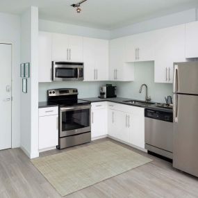 Street level studio apartment kitchen with enery efficient stainless appliances