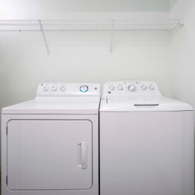 Washer and dryer with shelving