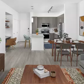 Open-concept living room and kitchen with built-in desk at Camden Thornton Park apartments in Orlando, FL