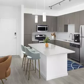 Kitchen in the mocha finish style at Camden Thornton Park apartments in Orlando, FL