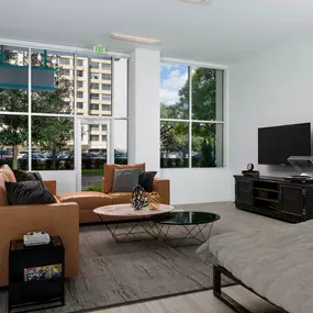 Street-level, Live/Work apartment living room with large windows at Camden Thornton Park apartments in Orlando, FL