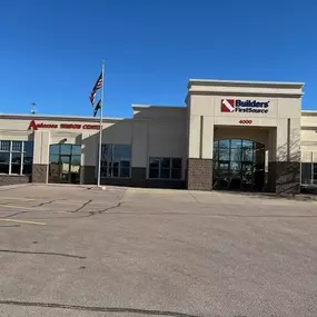 A large beige building with a sign reading 