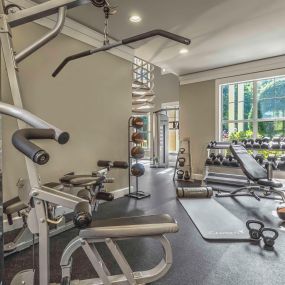 Multi-level fitness center with strength training and cardio equipment
