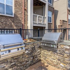 Grilling area next to resort-style pool at Camden Ballantyne in Charlotte North Carolina