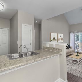 Townhome floor plan kitchen and living room with sliding glass doors to private balcony