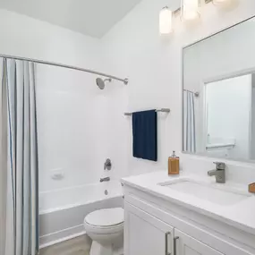 Renovated townhome bathroom with hardwood-style flooring at Camden Ballantyne in Charlotte, NC