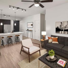 Open-concept floor plan with wood-style flooring and space to work from home at Camden Rainey Street apartments in Austin, TX