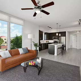 Living room and kitchen with bar seating at island wood look flooring and ceiling fan