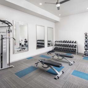 24-hour fitness center weight area at Camden Farmers Market apartments in Dallas, TX