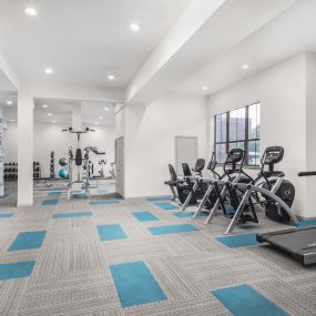 24-hour fitness center with cardio machines at Camden Farmers Market apartments in Dallas, TX