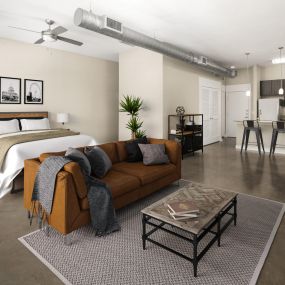 Loft-style living and bedroom at Camden Farmers Market Apartments in Dallas, TX
