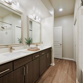 Contemporary-style bathroom with two sinks at Camden Farmers Market Apartments in Dallas, TX