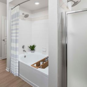 Townhome bathroom with bathtub and walk-in shower at Camden Farmers Market in Dallas, Tx