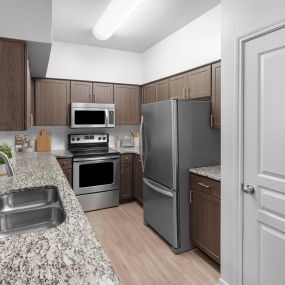 Townhome kitchen with granite countertops at Camden Farmers Market in Dallas, Tx