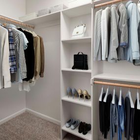 Contemporary-style closet with built-in shelves at Camden Farmers Market in Dallas, Tx