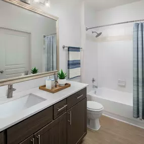 Contemporary-style bathroom with white-quartz countertops at Camden Farmers Market in Dallas, Tx