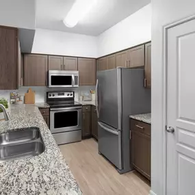 Townhome kitchen with granite countertops at Camden Farmers Market in Dallas, Tx