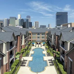 Balcony overlooking pool at Camden Farmers Market Apartments in Dallas, TX