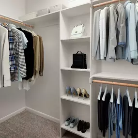 Contemporary-style closet with built-in shelves at Camden Farmers Market in Dallas, Tx