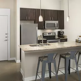 Loft-style kitchen at Camden Farmers Market Apartments in Dallas, TX