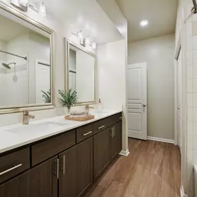 Contemporary-style bathroom with two sinks at Camden Farmers Market Apartments in Dallas, TX