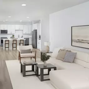Townhome first floor living room and kitchen with wood-style flooring at Camden Farmers Market apartments in Dallas, TX