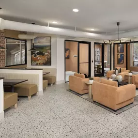 Community workspace with private offices and various seating options at Camden Farmers Market apartments in Dallas, Tx