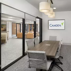 Community workspace private conference room with TV at Camden Farmers Market apartments in Dallas, Tx