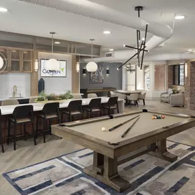 Resident lounge with pool table, bar seating, and entertaining kitchen at Camden Farmers Market apartments in Dallas, Tx