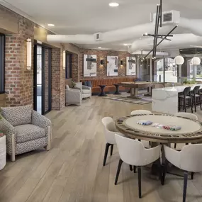 Resident lounge with poker table and seating at Camden Farmers Market apartments in Dallas, Tx
