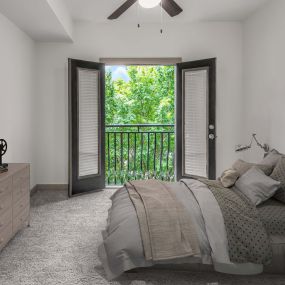 Loft bedroom with carpet, ceiling fan, and juliette balcony