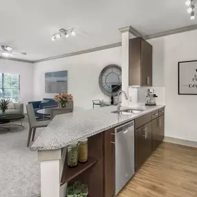 Kitchen with granite countertops, hardwood-style flooring, and track lighting