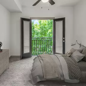 Loft bedroom with carpet, ceiling fan, and juliette balcony