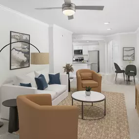 Modern open-concept living room with ceiling fan at Camden Midtown Atlanta in Atlanta, GA