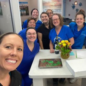 Dr. Carly Paragas & Dr. Caitlin Kompanowski share some happy moments with their team of dental professionals at Advanced Solutions Family Dental
