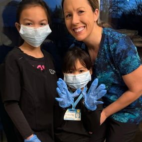 Dr Carly with here little patients in her dental office