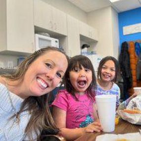 Dr Carly Paragas with cute little patients