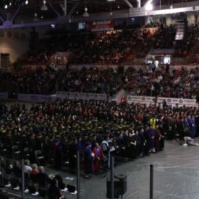 The graduation ceremony at St. Cloud State University at Plymouth is held in a large gymnasium.